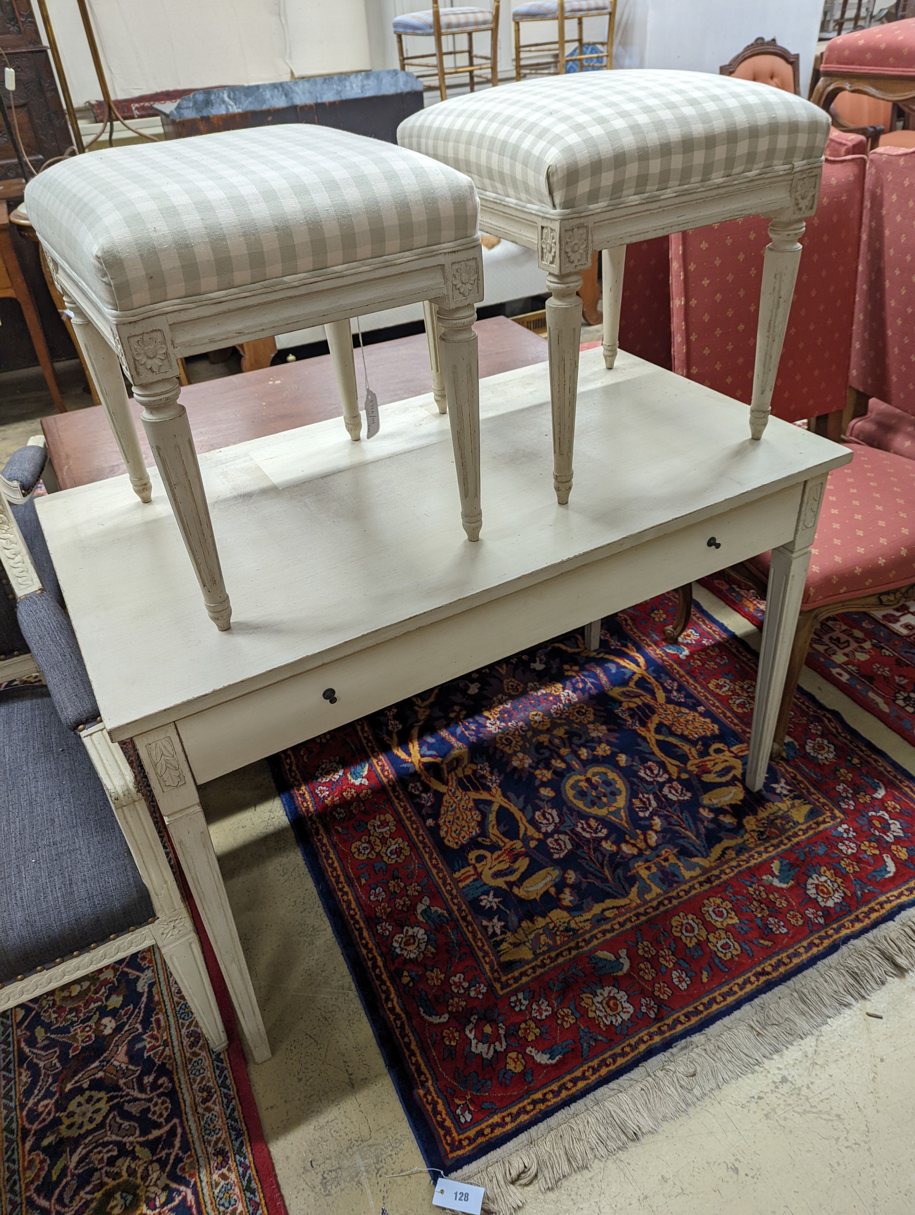 A rectangular painted dressing table, width 110cm, depth 60cm, height 75cm, together with two painted dressing stools